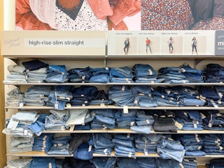 An area shot of a Universal Threads jeans display with jeans sitting on its shelves.