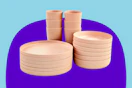 Stock image of the Mainstays 18-Piece Eco-Friendly Recycled Plastic Dinnerware Set (in the color pink)