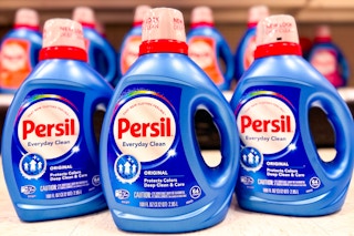 3 bottles Persil laundry detergent sitting on the floor at target