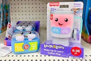 Fisher-Price Laugh & Learn Mug and Ear Pods on shelf at Target