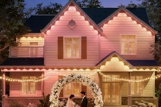 a wedding in front of outdoor lights