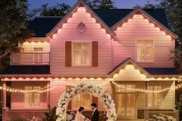 a wedding in front of outdoor lights