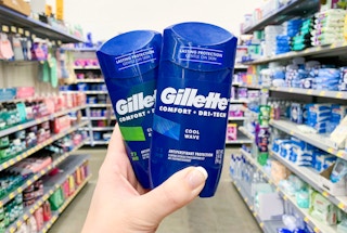 gillette comfort dri tech deodorant held up in center of aisle