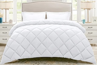 Lifestyle image (bedroom setting) of a white quilted 3-piece bed in a bag (brand JUSTLET)