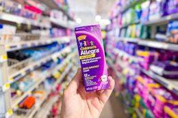 hand holding up allegra childrens