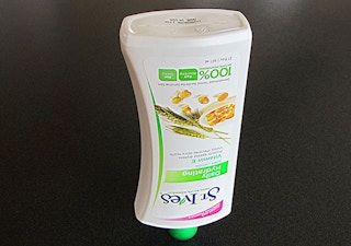 St Ives lotion bottle sitting upside down.