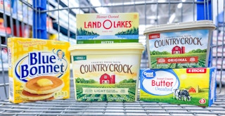 Different brands of butter in a Walmart shopping cart