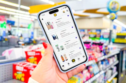 hand holiding smartphone displaying 1-clip coupons in the kcl app