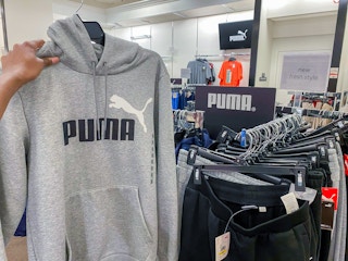 hand holding puma hoodie