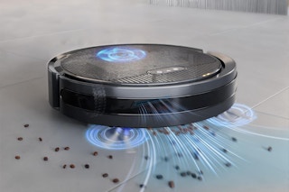 Robot vacuum and mop combo picks up crumbs from floor