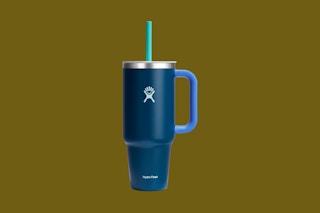a hydro flask tumbler on an olive background
