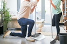 Family using broom and dustpan