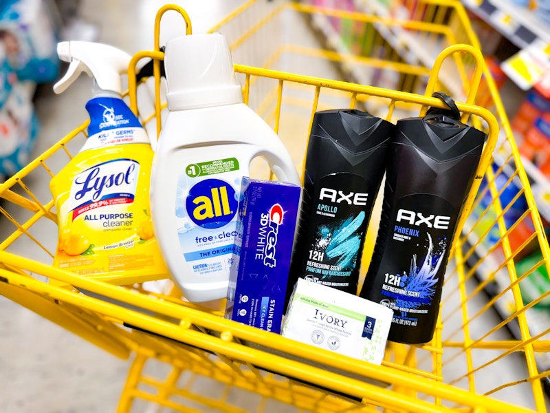 lysol spray, all detergent, crest toothpaste, ivory bar soap and 2 axe body washes in a cart