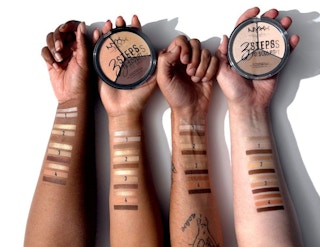 Arms with NYX shade swatches on them.