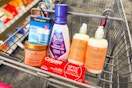 neutrogena moisturizer, shea moisture hair gel, colgate toothpaste, crest mouthwash, and sheamoisture shampoo in a cart