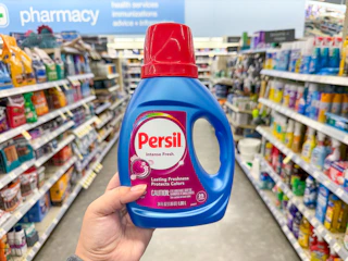 hand holding persil detergent in walgreens