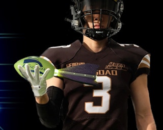 a football player holding a foam football