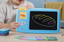 child playing with learning LCD tablet