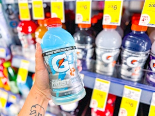 hand holding gatorade bottle in walgreens