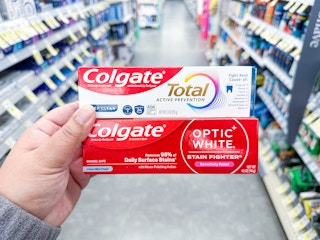 hand holding colgate toothpastes walgreens