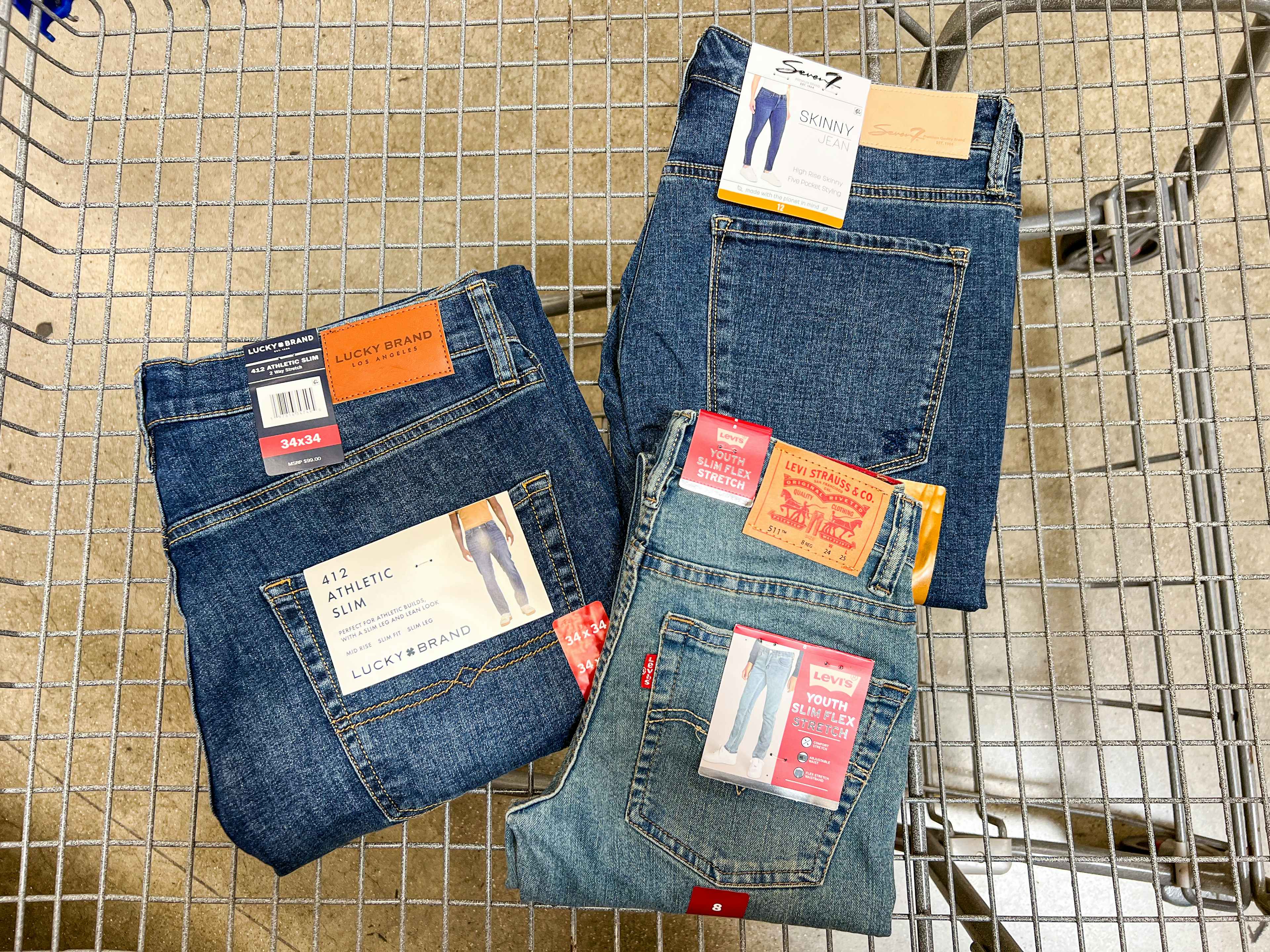 3 pairs of jeans in a cart