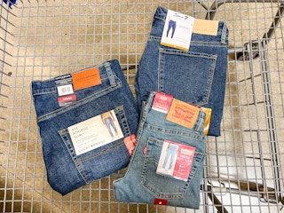 3 pairs of jeans in a cart