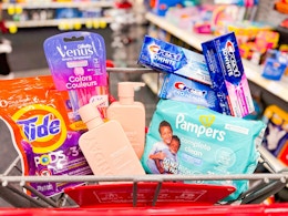 cvs shopping cart with tide, venus, crest, pampers, and monday products