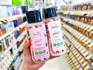 hand holding love beauty and planet shampoo and conditioner