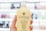 hand holding hairitage shampoo