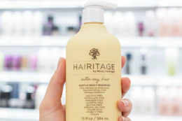hand holding hairitage shampoo