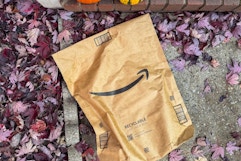 an amazon box being held