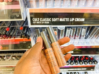 hand holding NYX soft matte lip cream