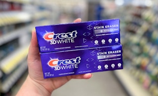 hand holding crest 3d white stain eraser toothpaste