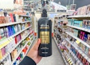 hand holding tresemme shampoo in walgreens