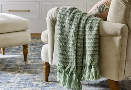 studio mcgee throw blanket sitting on a chair