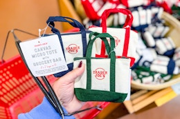hand holding trader joes micro totes