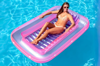 Lifestyle image of woman floating in the pool in a Swimline float