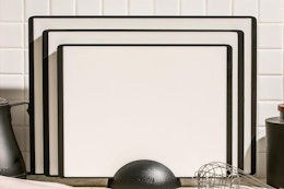 a cutting board set against a wall