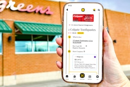 hand holding kcl app in front of store with colgate 1-clip coupon