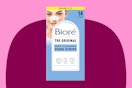 A 14-count pack of Biore Blackhead Remover Strips is against a maroon background with pink trim.