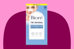 A 14-count pack of Biore Blackhead Remover Strips is against a maroon background with pink trim.