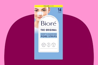 A 14-count pack of Biore Blackhead Remover Strips is against a maroon background with pink trim.