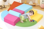 a toddler on foam blocks