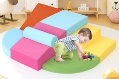 a toddler on foam blocks