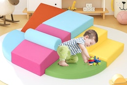 a toddler on foam blocks