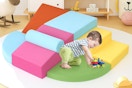 a toddler on foam blocks