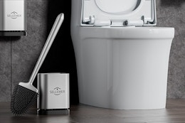 a toilet brush holder in a bathroom