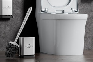 a toilet brush holder in a bathroom