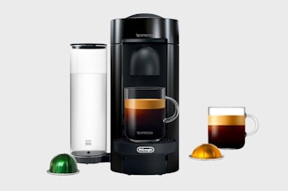 a black Nespresso Vertuo Plus Coffee Maker on gray background