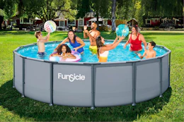 Lifestyle image of the Funsicle Above Ground swimming pool being used outdoors by a group of people